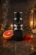Lattafa Asad Elixir men’s perfume bottle surrounded by rich scent notes on gold backdrop, premium masculine fragrance
